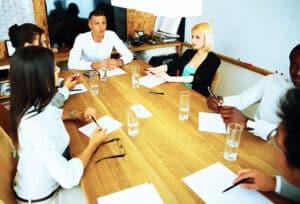 Businesspeople having meeting around table in office